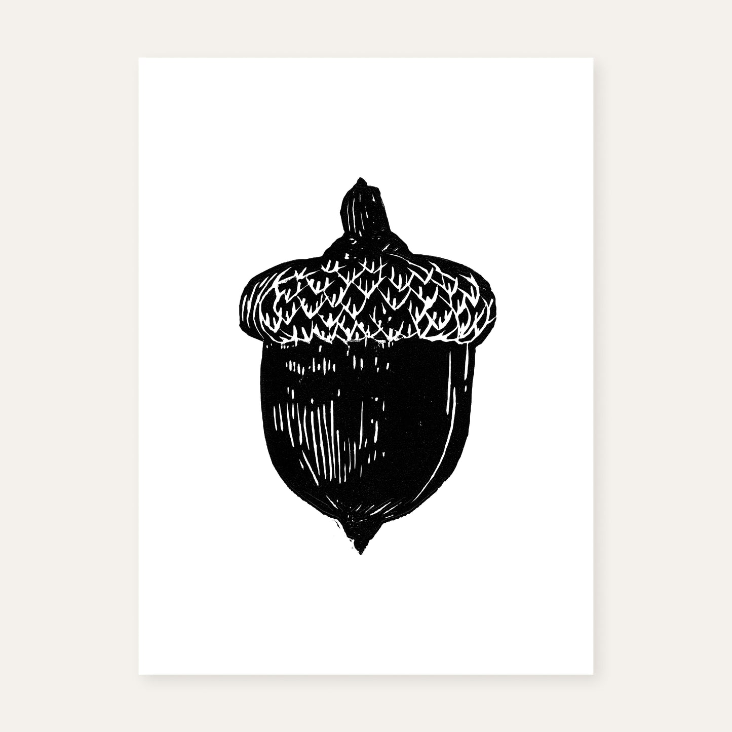 Linocut print of an acorn.
