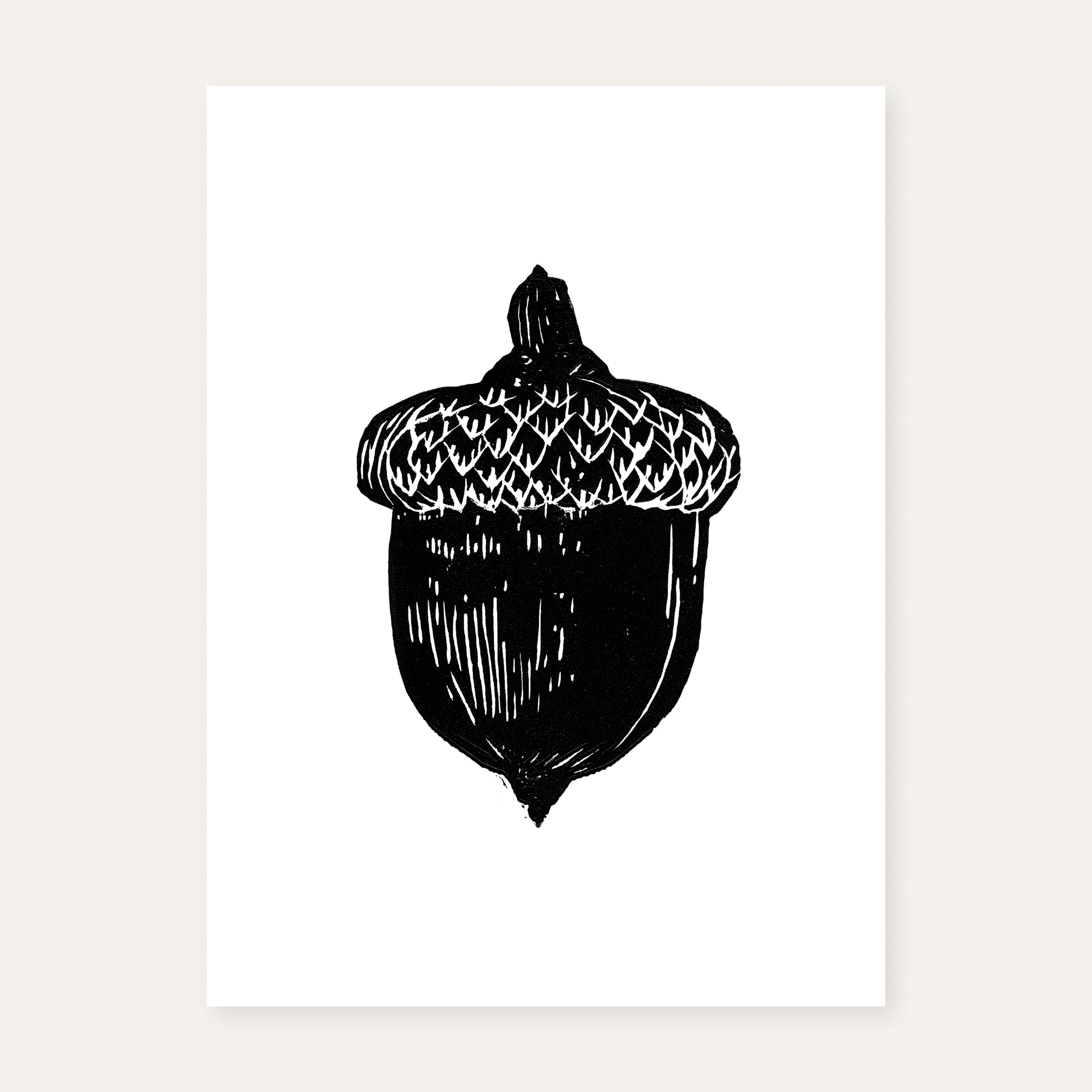 Linocut print of an acorn.