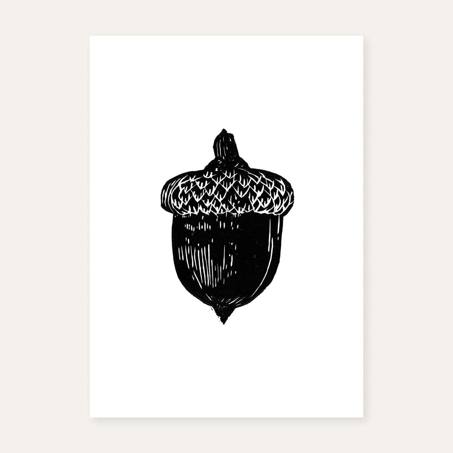 Linocut print of an acorn.